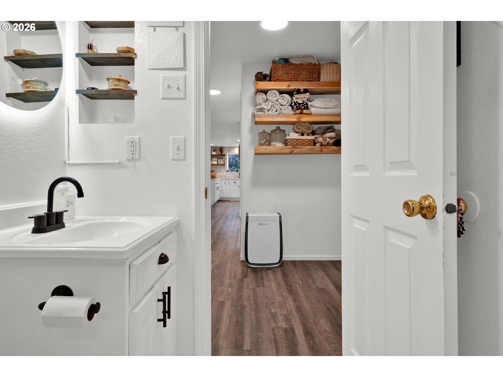 1265 Laurel Street Florence, OR 97439 - Photo 28 of 42 a bathroom with a sink and a mirror