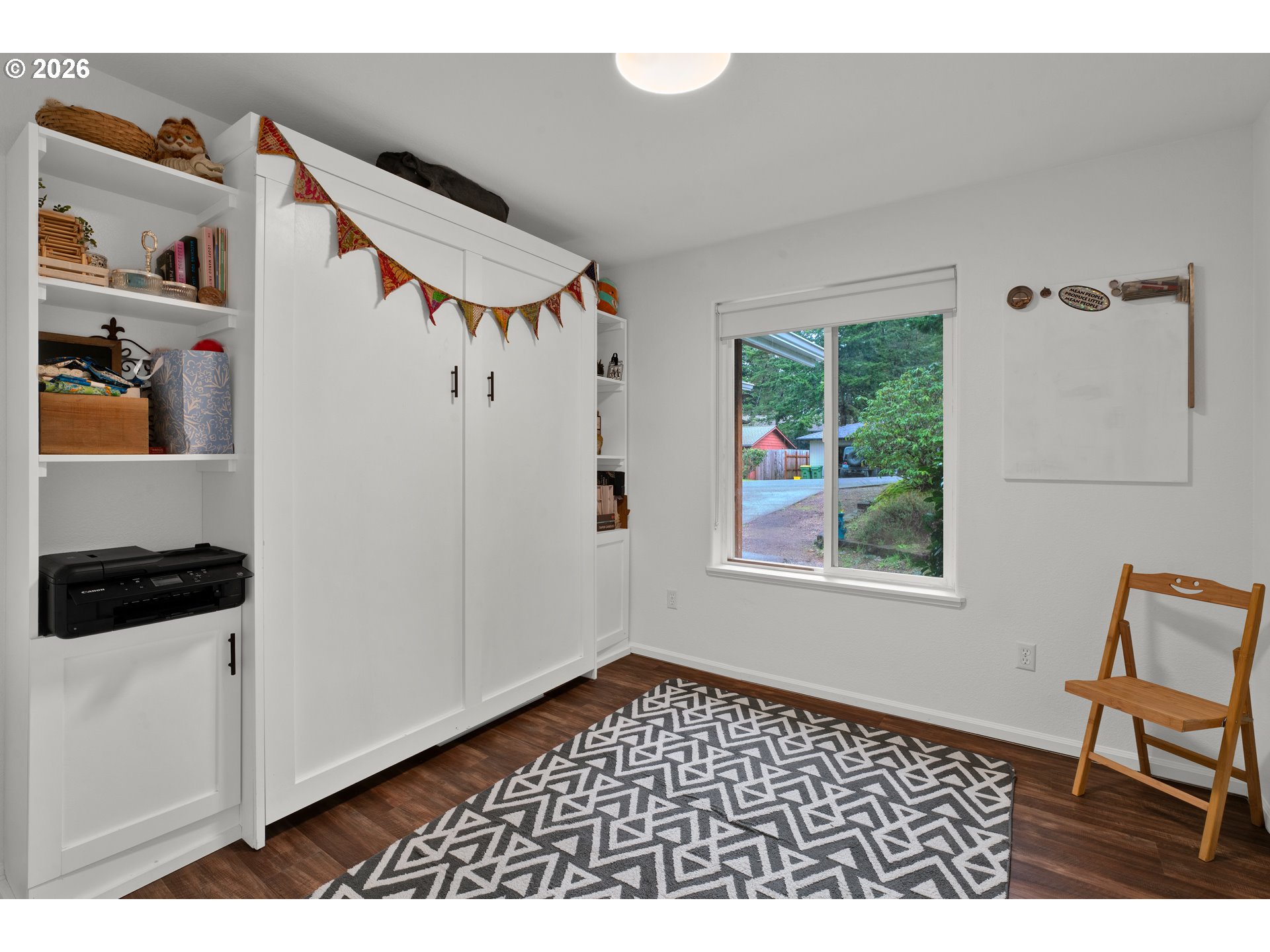 1265 Laurel Street Florence, OR 97439 - Photo 31 of 42 a view of a bedroom with furniture and window