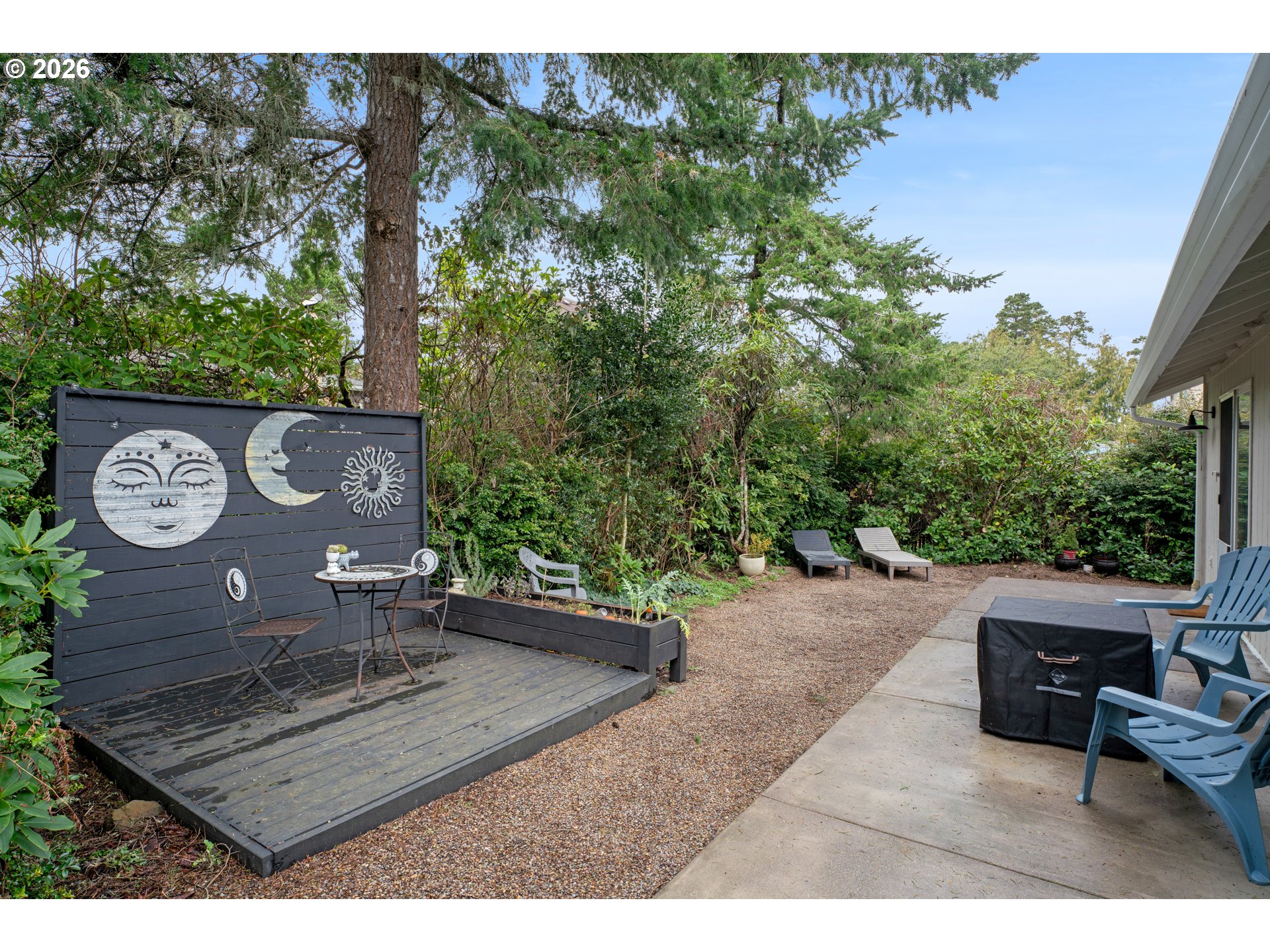 1265 Laurel Street Florence, OR 97439 - Photo 35 of 42 a view of a bench in a garden
