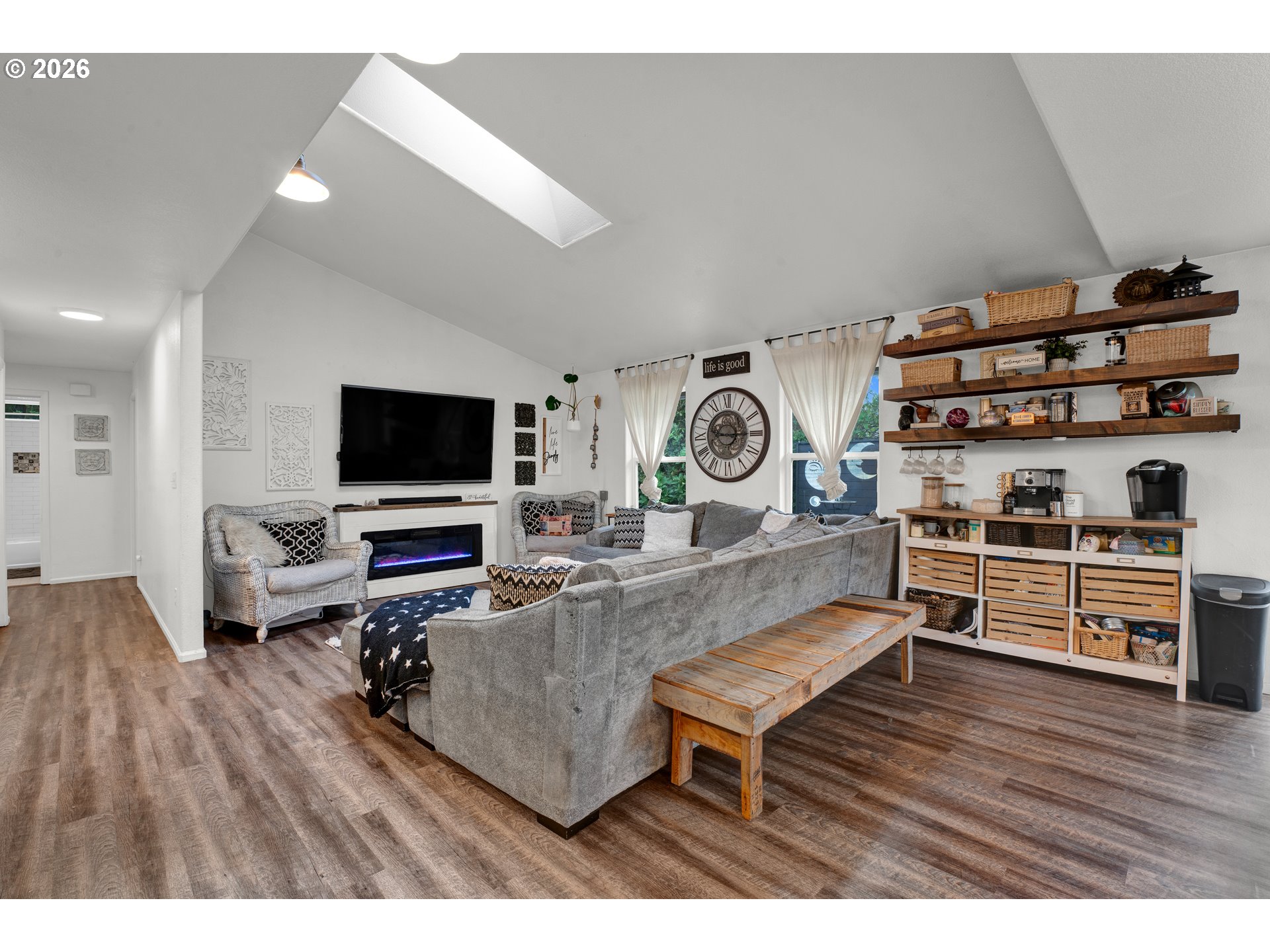 1265 Laurel Street Florence, OR 97439 - Photo 8 of 42 a living room with furniture and a flat screen tv