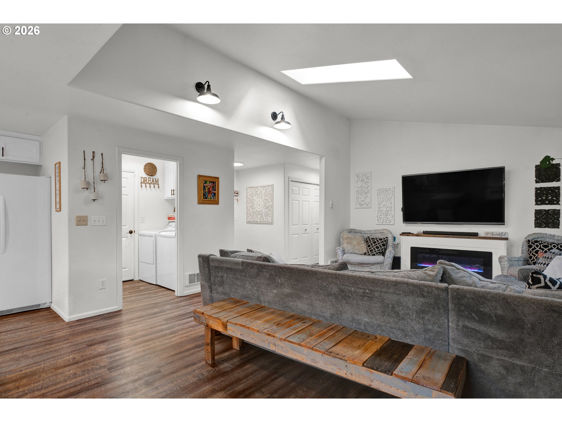 1265 Laurel Street Florence, OR 97439 - Photo 10 of 42 a living room with furniture and a flat screen tv