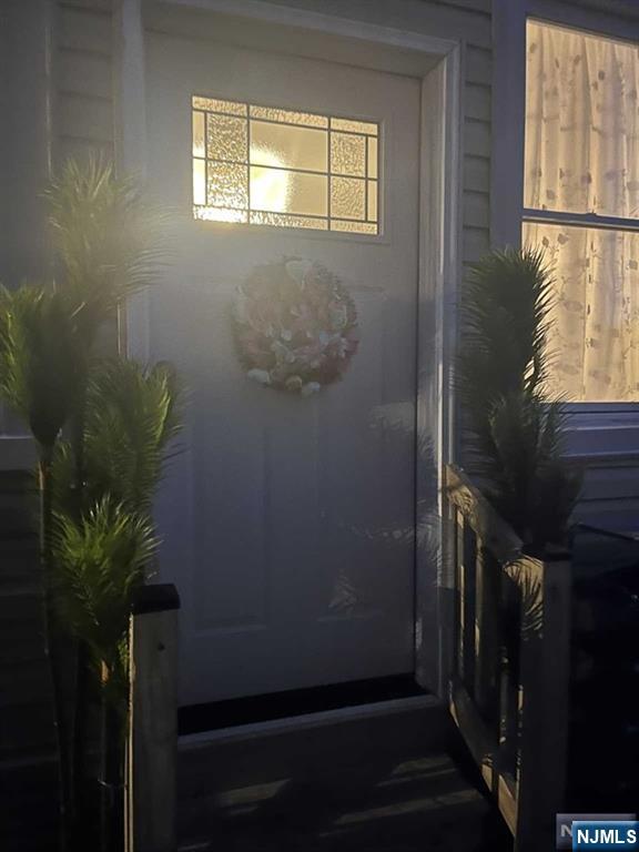 259 MacArthur Avenue, Unit 2 Garfield, NJ 07026 - Photo 12 of 12 a view of balcony with wooden floor