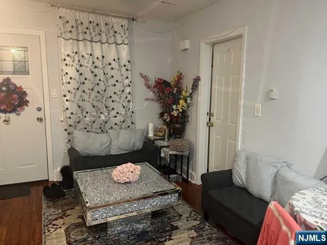 a living room with furniture and a rug