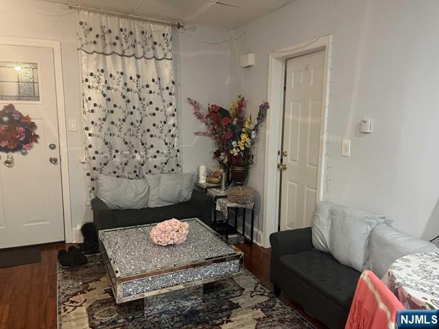 259 MacArthur Avenue, Unit 2 Garfield, NJ 07026 - Photo 4 of 12 a living room with furniture and a rug