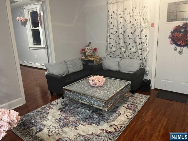 259 MacArthur Avenue, Unit 2 Garfield, NJ 07026 - Photo 5 of 12 a living room with furniture and a rug