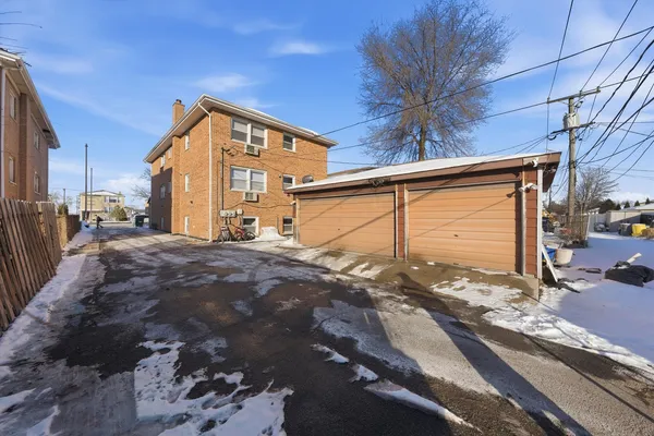 a view of a house with a snow in the yard