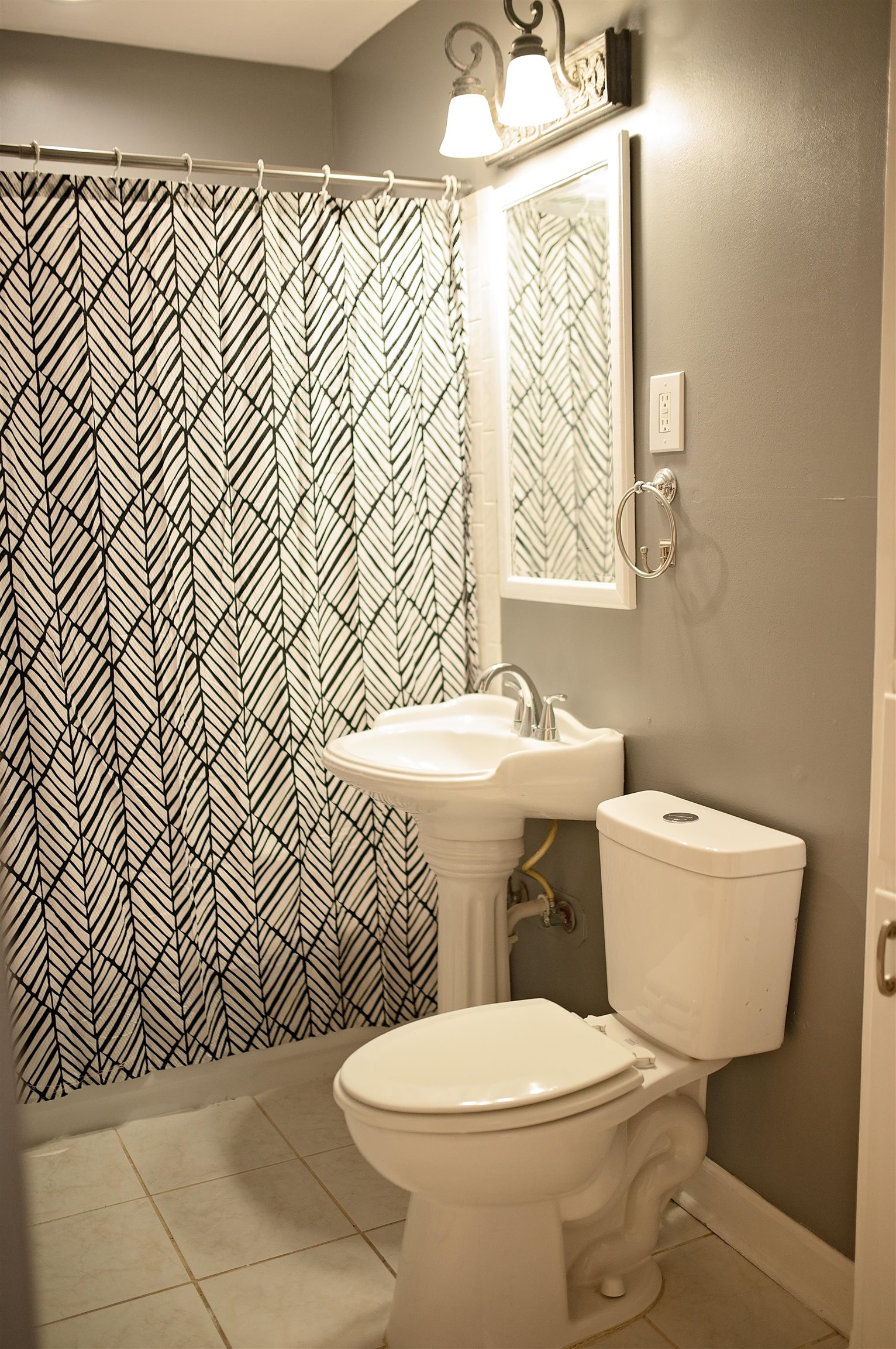 1351 Marcia Road Memphis, TN 38117 - Photo 8 of 10 a white toilet sitting next to a bathroom sink