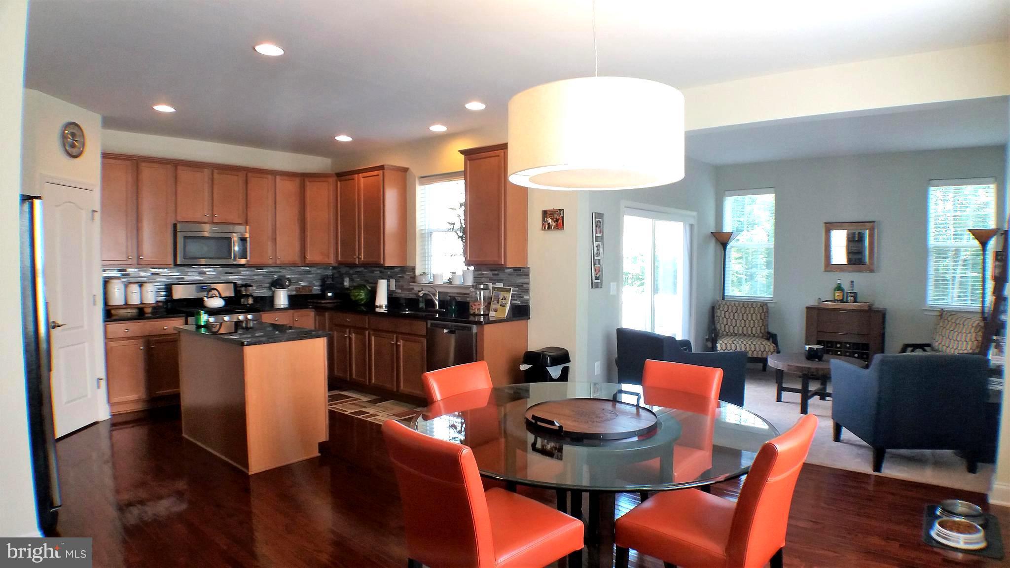 42251 Castle Ridge Square Ashburn, VA 20148 - Photo 10 of 29 Open floor plan showcasing kitchen to family