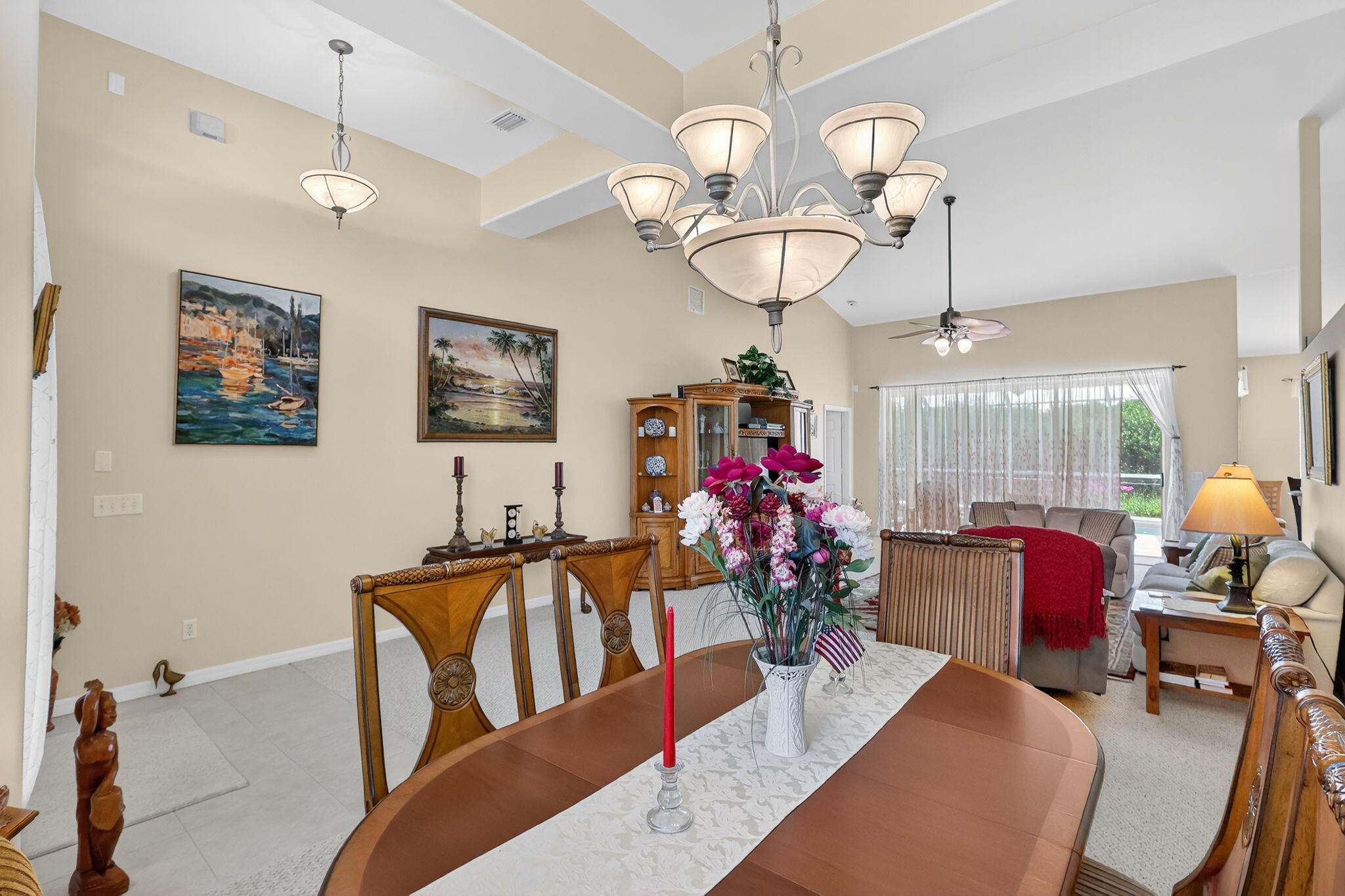 3075 73rd Place Vero Beach, FL 32967 - Photo 11 of 65 a view of a dining room with furniture wooden floor and chandelier