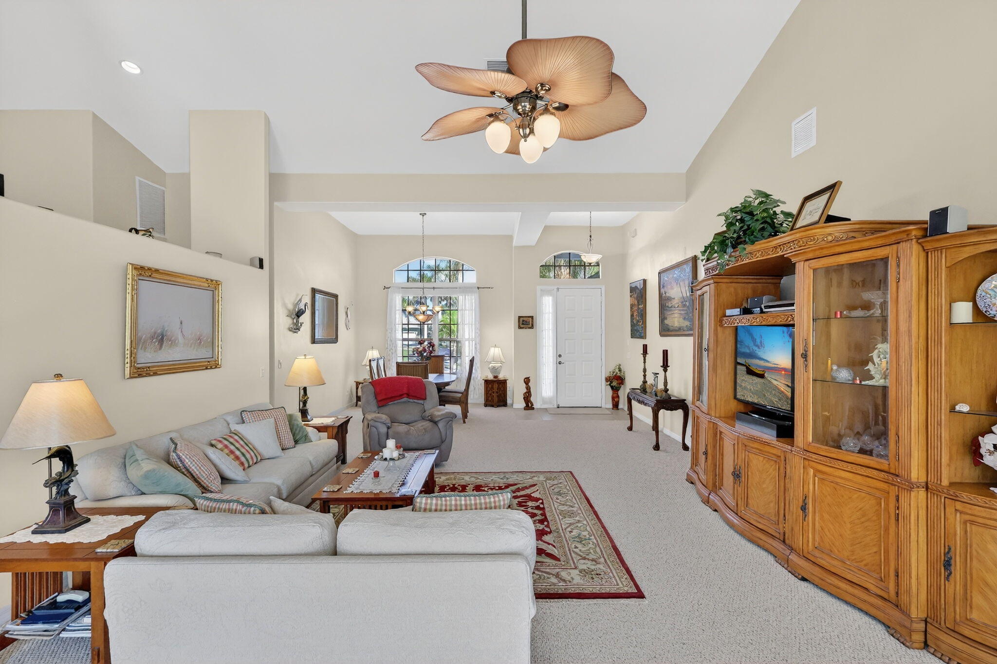 3075 73rd Place Vero Beach, FL 32967 - Photo 12 of 65 a living room with furniture kitchen view and a large window