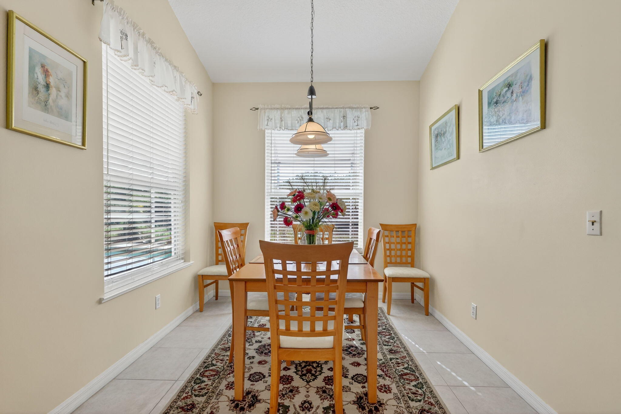 3075 73rd Place Vero Beach, FL 32967 - Photo 16 of 65 a view of a dining room with furniture and window
