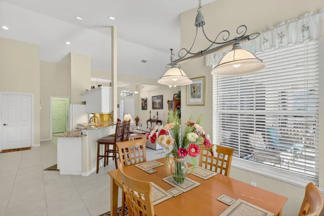 a outdoor dining space with furniture and window