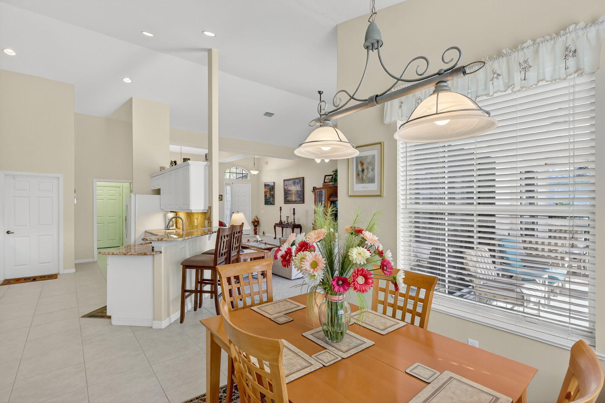 3075 73rd Place Vero Beach, FL 32967 - Photo 18 of 65 a outdoor dining space with furniture and window