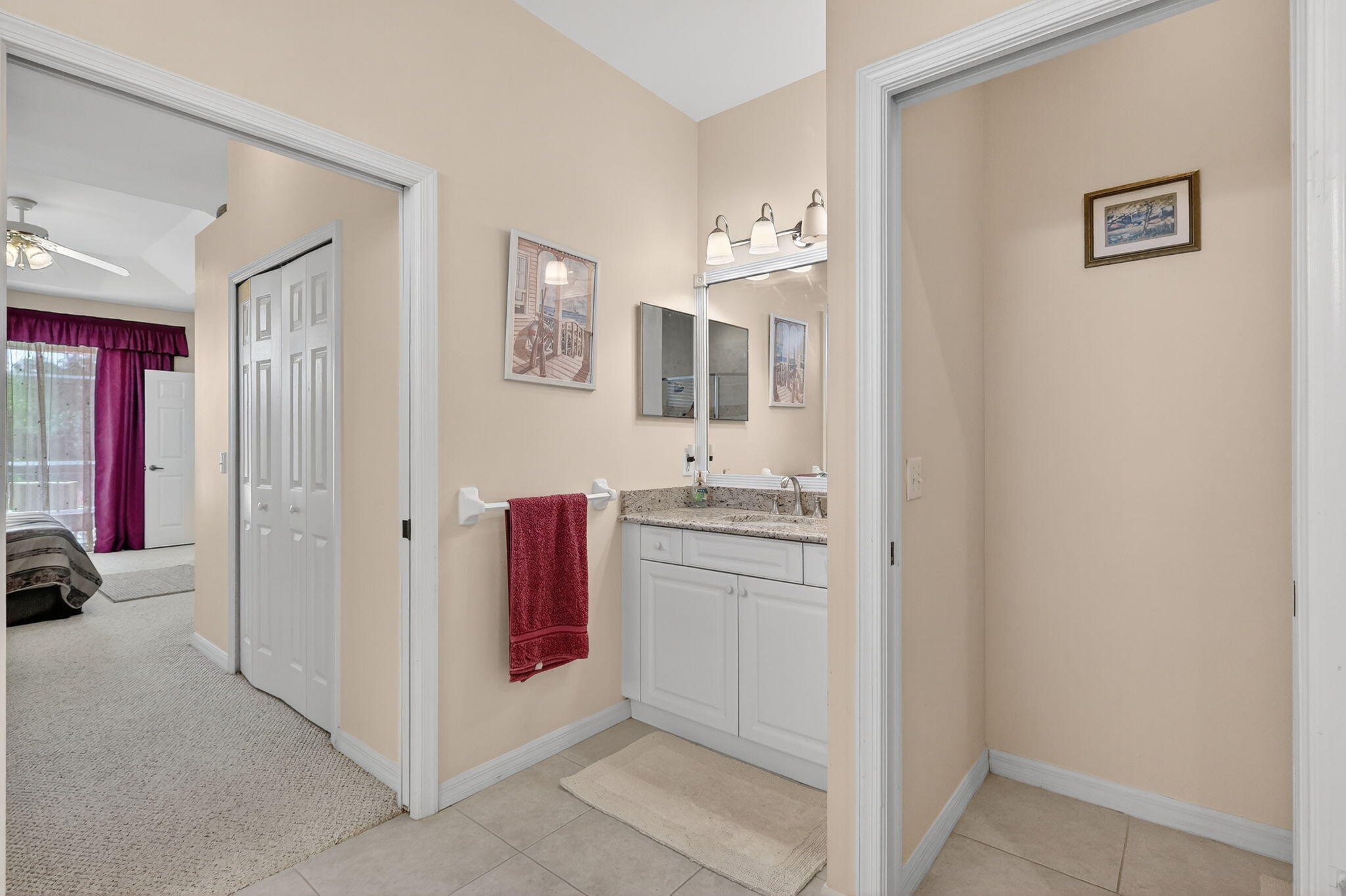 3075 73rd Place Vero Beach, FL 32967 - Photo 25 of 65 a bathroom with a sink and a mirror