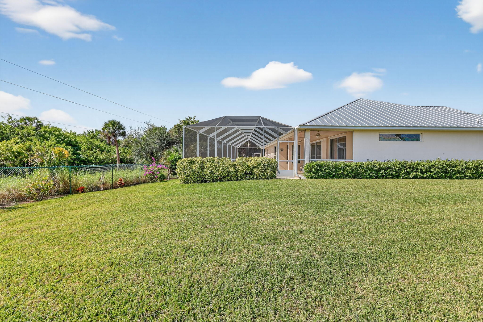 3075 73rd Place Vero Beach, FL 32967 - Photo 39 of 65 a view of a house with a yard and a garden