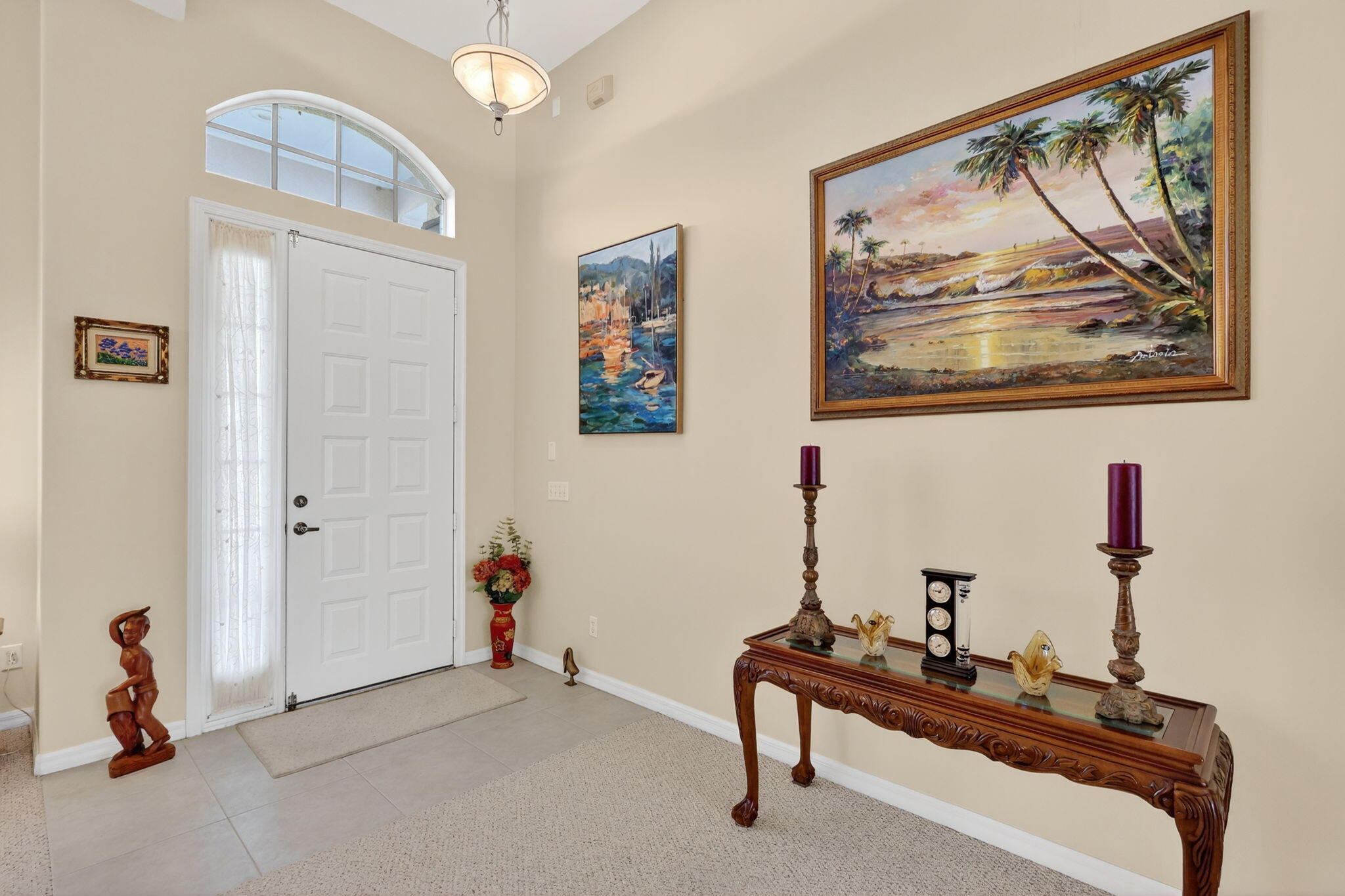 3075 73rd Place Vero Beach, FL 32967 - Photo 4 of 65 a living room with furniture and a wall painting