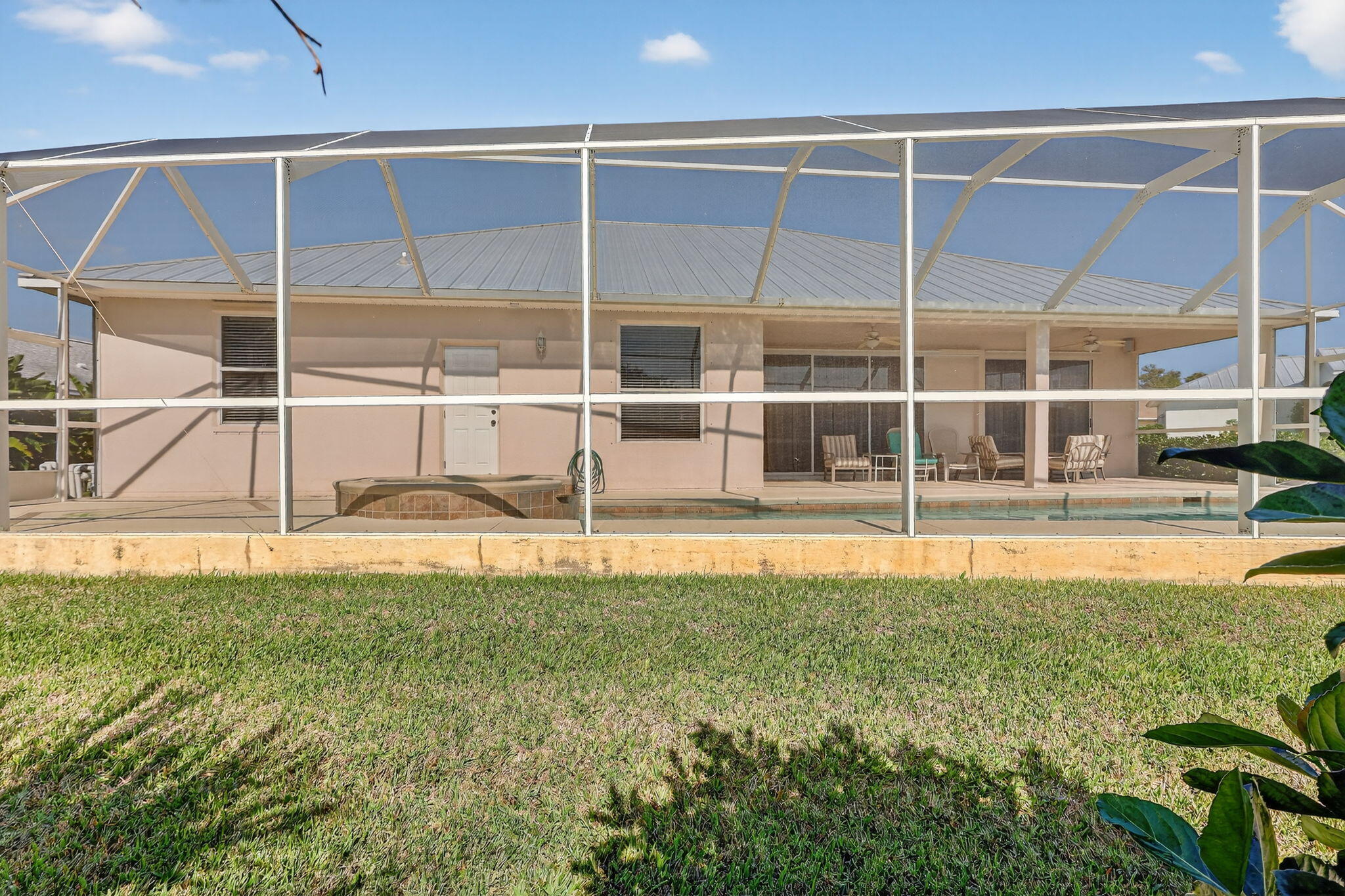 3075 73rd Place Vero Beach, FL 32967 - Photo 42 of 65 a view of a swimming pool with an outdoor space