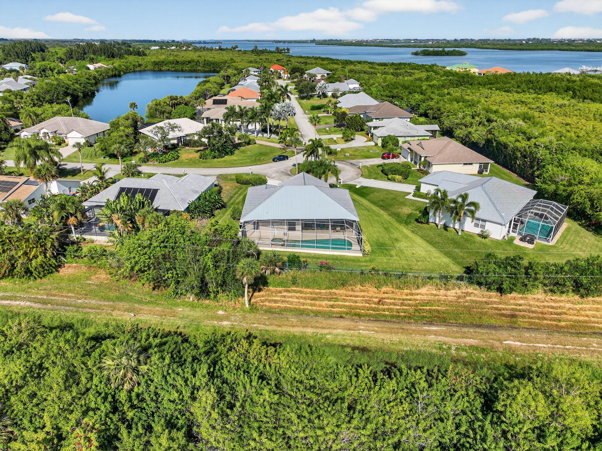 3075 73rd Place Vero Beach, FL 32967 - Photo 55 of 65 a view of a lake with a house