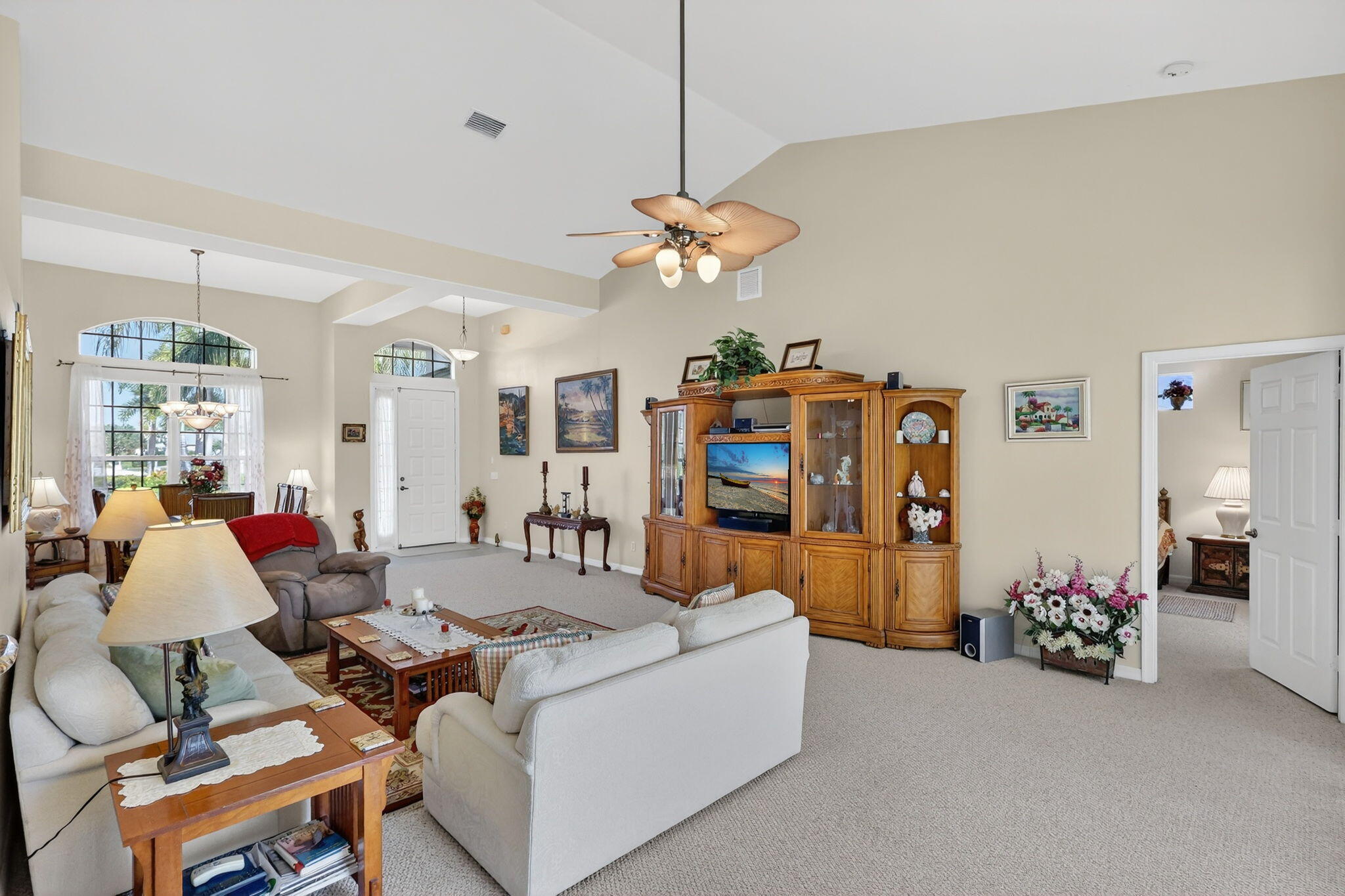 3075 73rd Place Vero Beach, FL 32967 - Photo 7 of 65 a living room with furniture and a flat screen tv