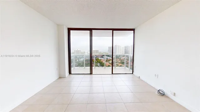 a view of an empty room with a sliding door