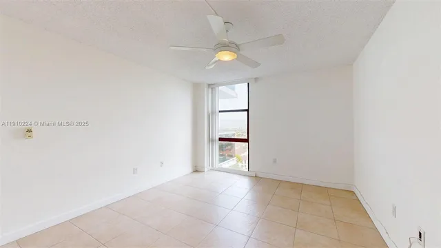 an empty room with a empty space and windows