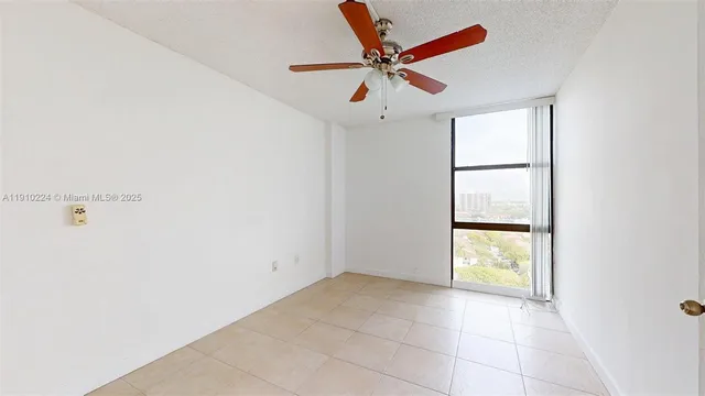 a view of room with ceiling fan