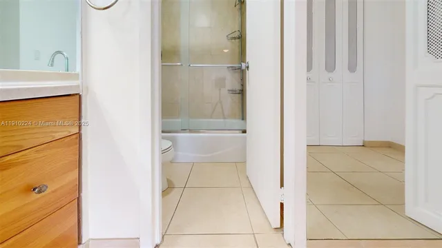 a living room with furniture and a book shelf