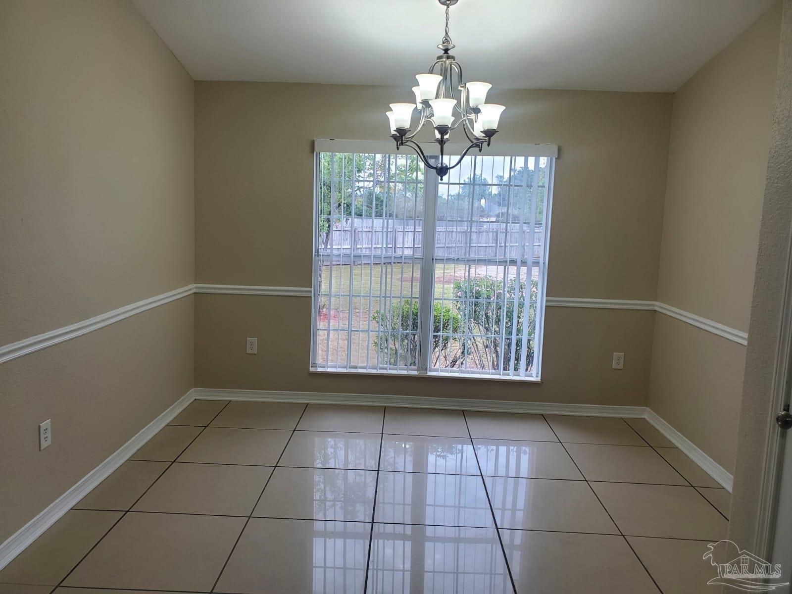 659 Griswold Road Jay, FL 32565 - Photo 10 of 42 a view of an empty room with a window