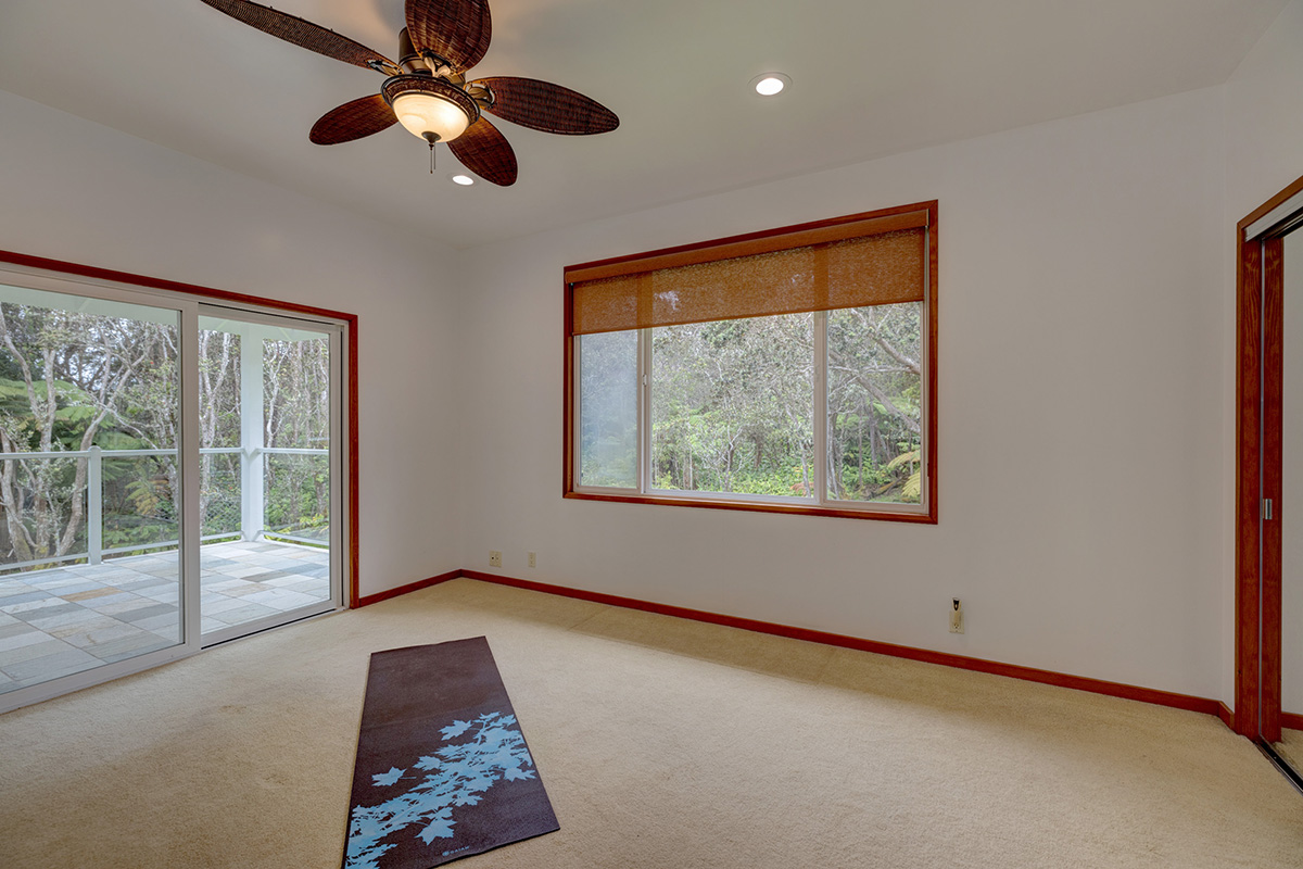 19-4221 Haunani Road Volcano, HI 96785 - Photo 16 of 30 en empty room with windows and ceiling fan