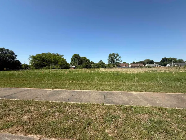 a view of a lake with a big yard