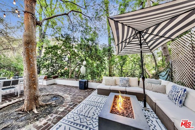 a view of sitting area with furniture and wooden floor