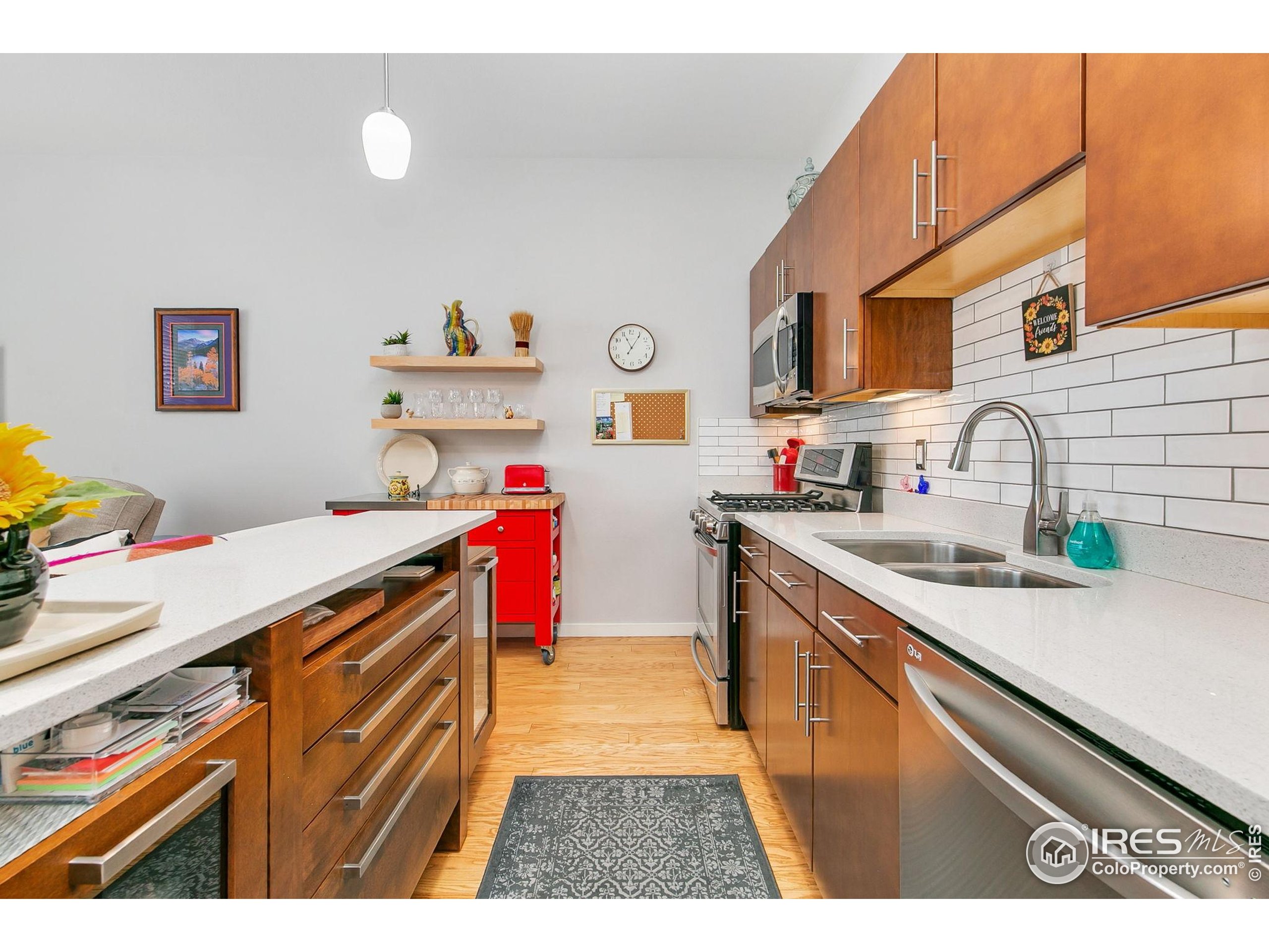 204 Maple Street, Unit 207 Fort Collins, CO 80521 - Photo 12 of 21 a kitchen that has a sink and a stove