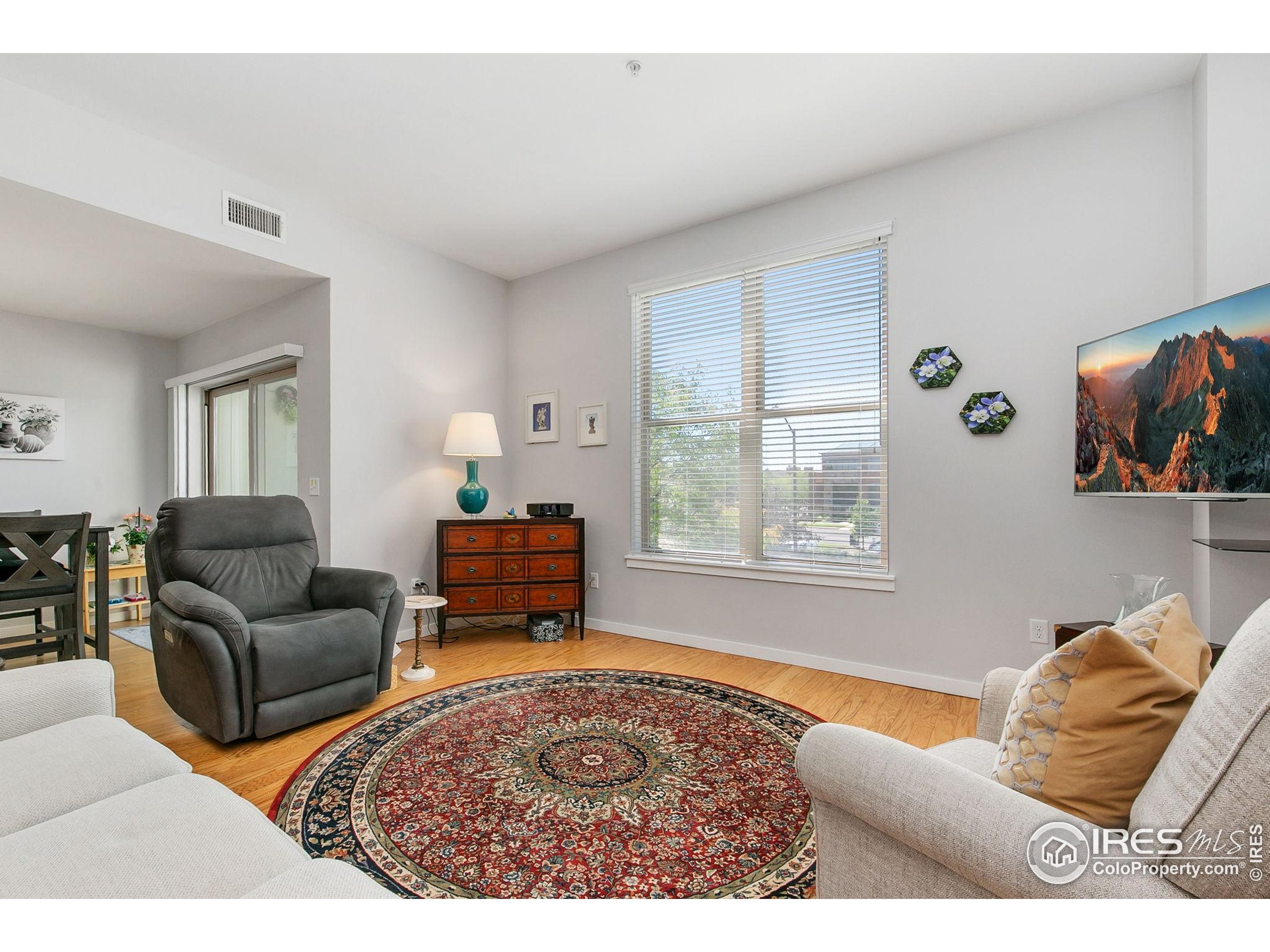 204 Maple Street, Unit 207 Fort Collins, CO 80521 - Photo 13 of 21 a bedroom with furniture and a window