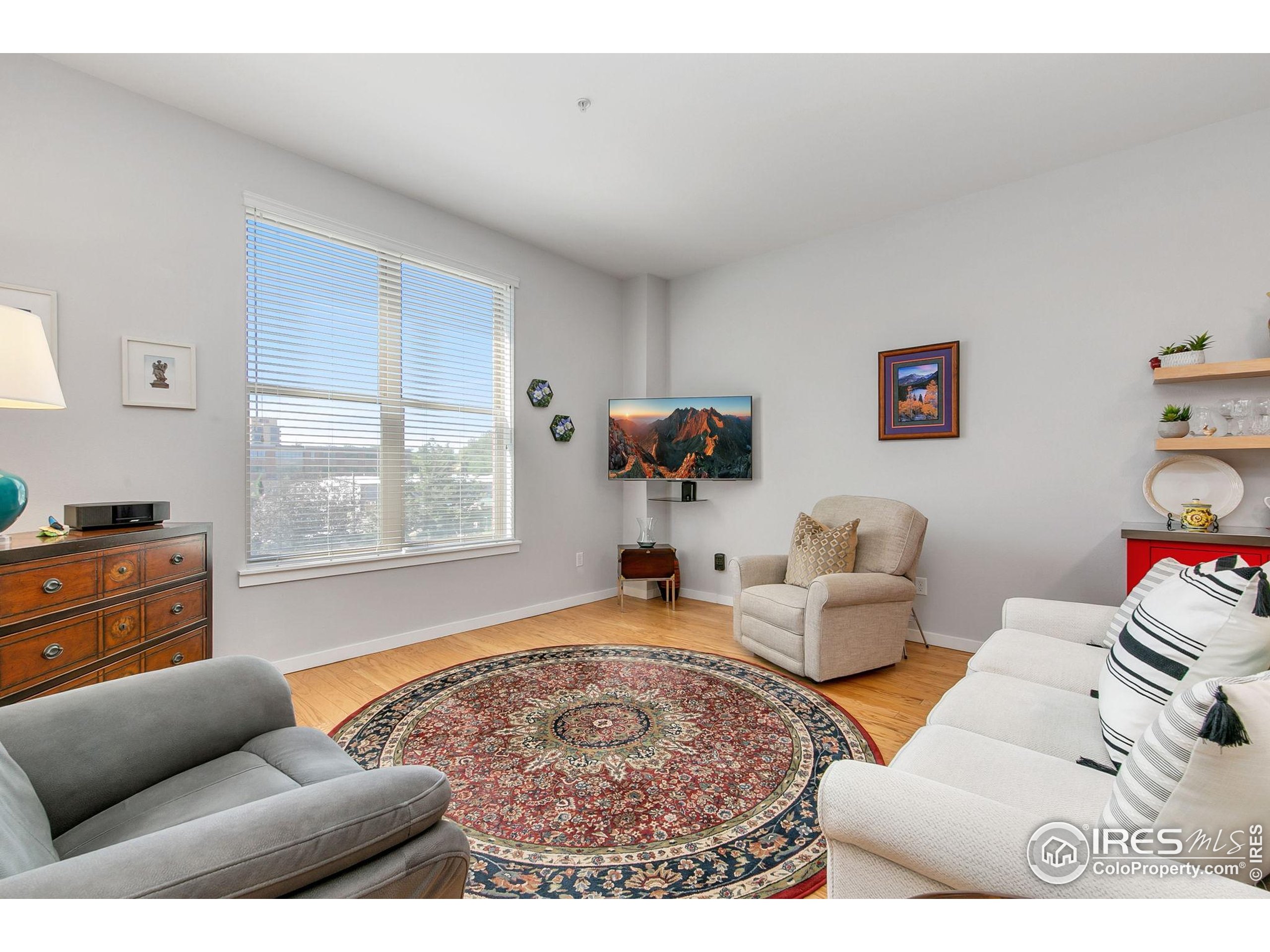204 Maple Street, Unit 207 Fort Collins, CO 80521 - Photo 14 of 21 a living room with furniture and a window