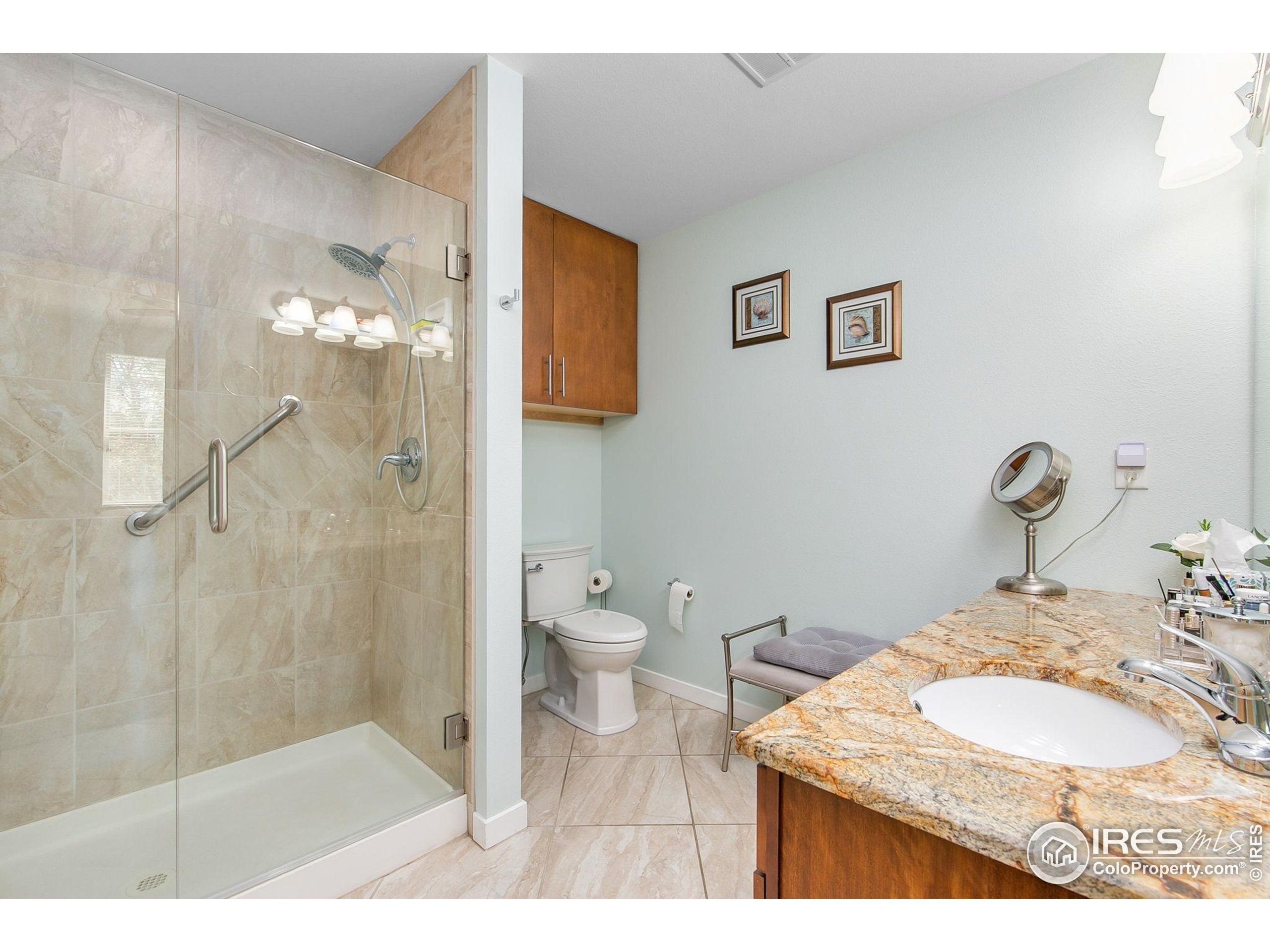 204 Maple Street, Unit 207 Fort Collins, CO 80521 - Photo 21 of 21 a bathroom with a sink toilet and shower