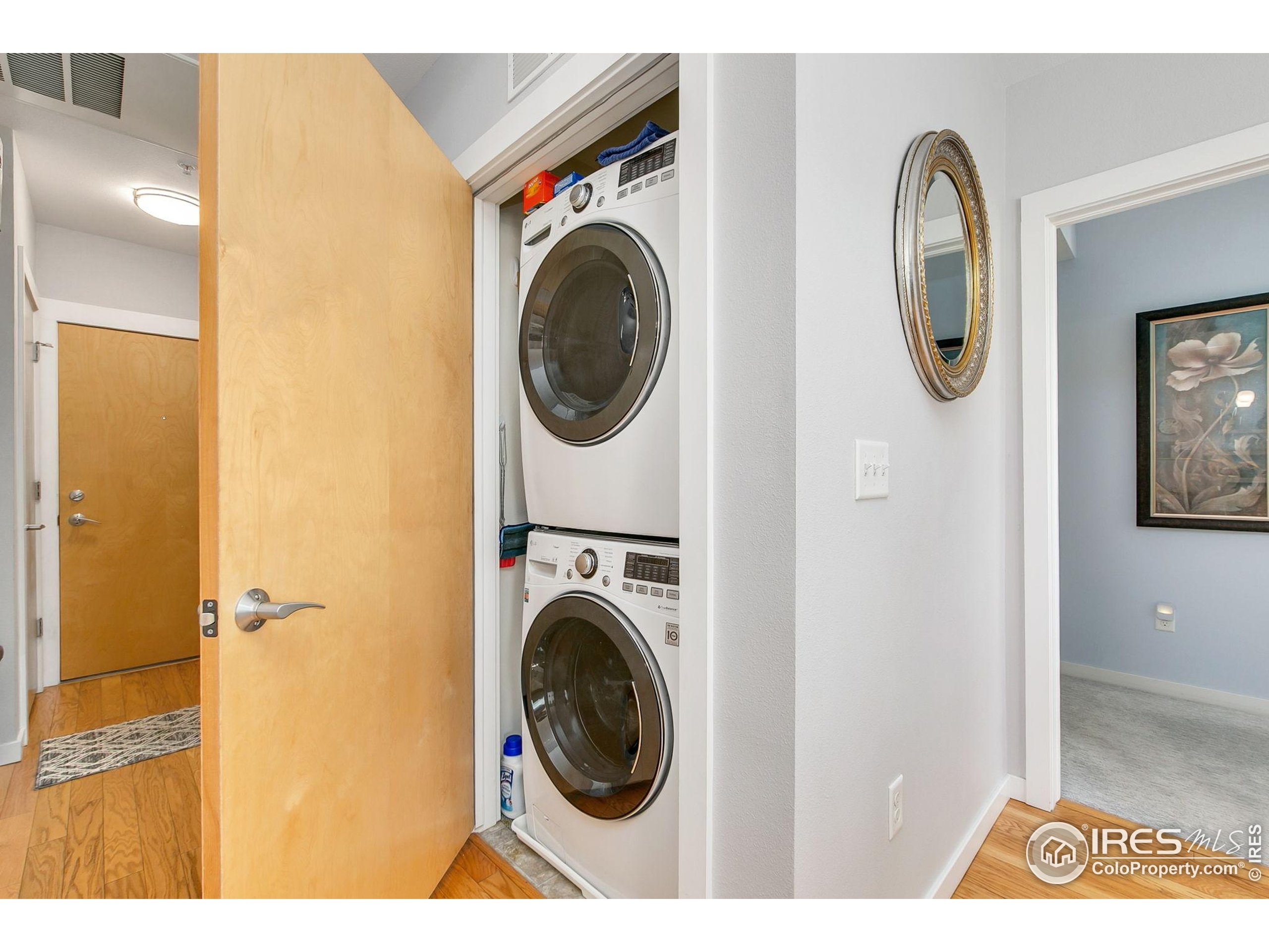 204 Maple Street, Unit 207 Fort Collins, CO 80521 - Photo 6 of 21 a view of a hallway with washer and dryer