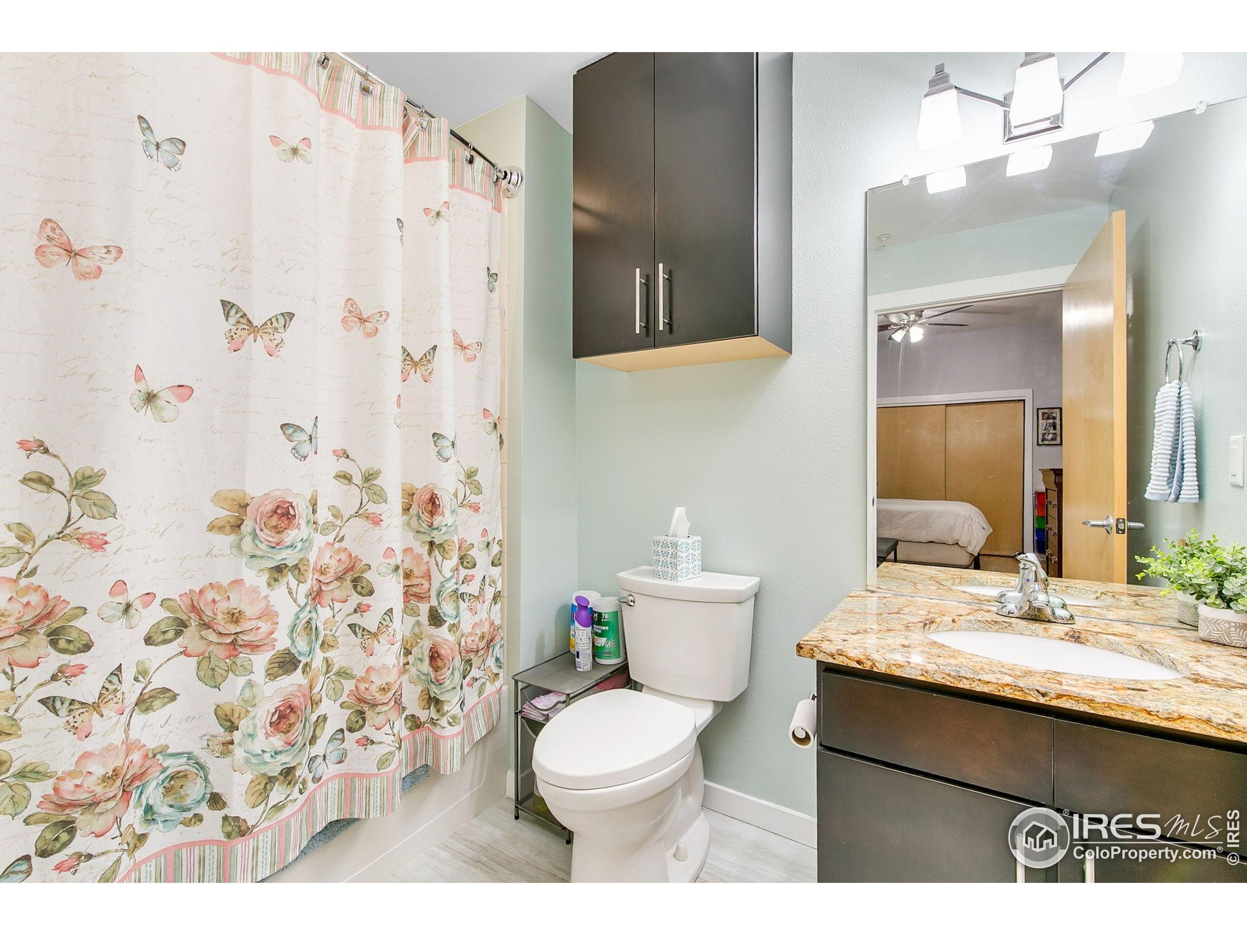 204 Maple Street, Unit 207 Fort Collins, CO 80521 - Photo 9 of 21 a bathroom with a sink toilet and shower