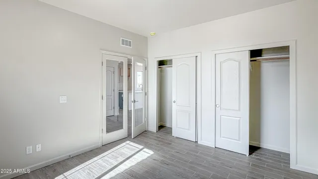 a view of entryway with wooden floor