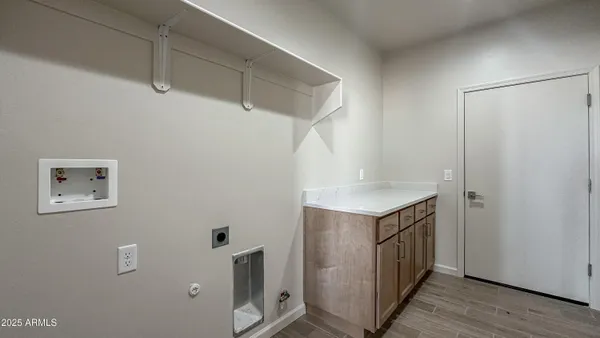 a bathroom with a shower and a sink