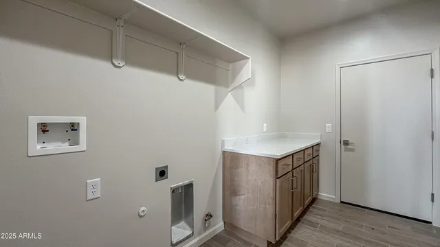 a bathroom with a shower and a sink