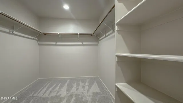 a view of an empty walk in closet