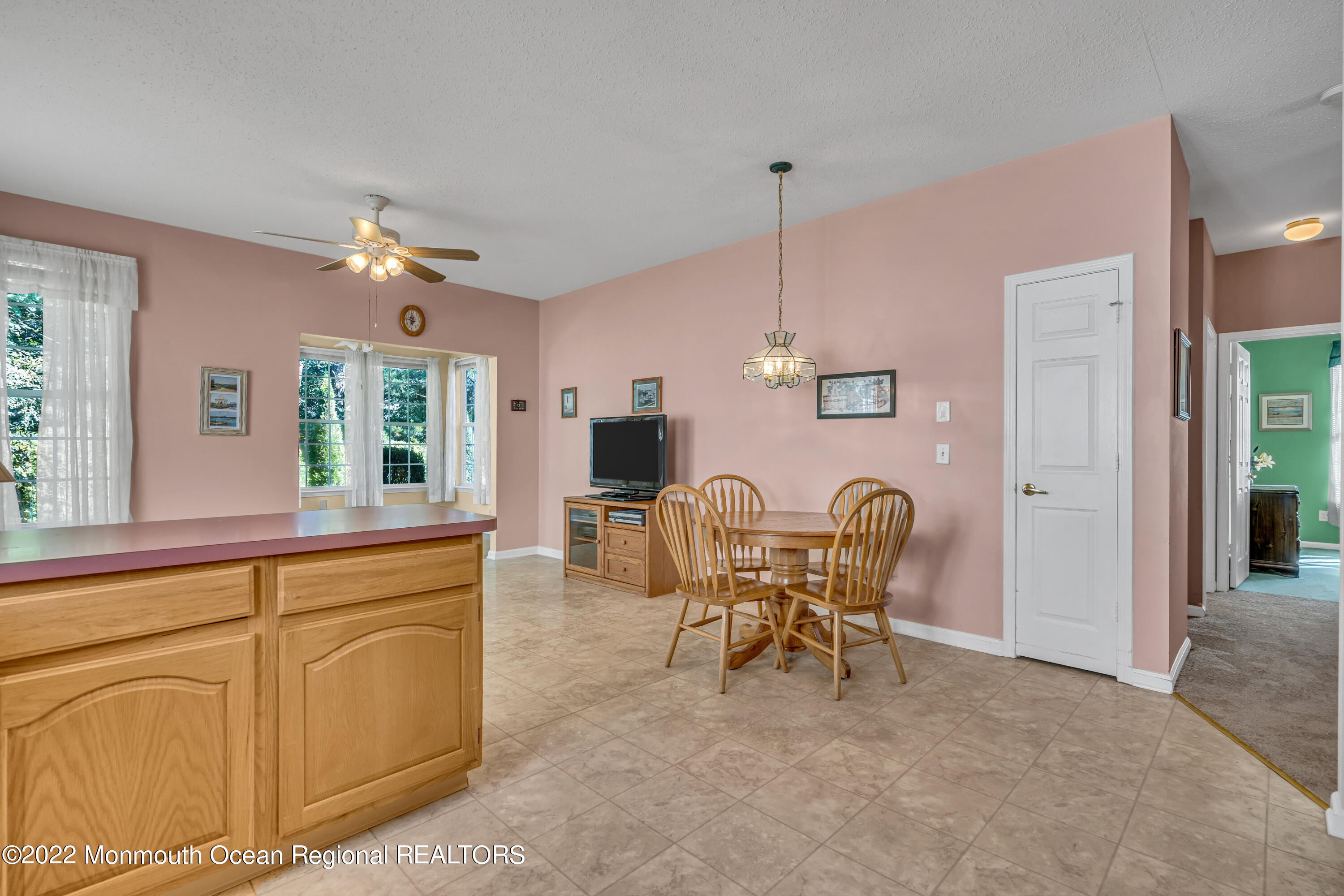 59 Quail Road Barnegat, NJ 08005 - Photo 13 of 30 a view of a dining room with furniture and chandelier