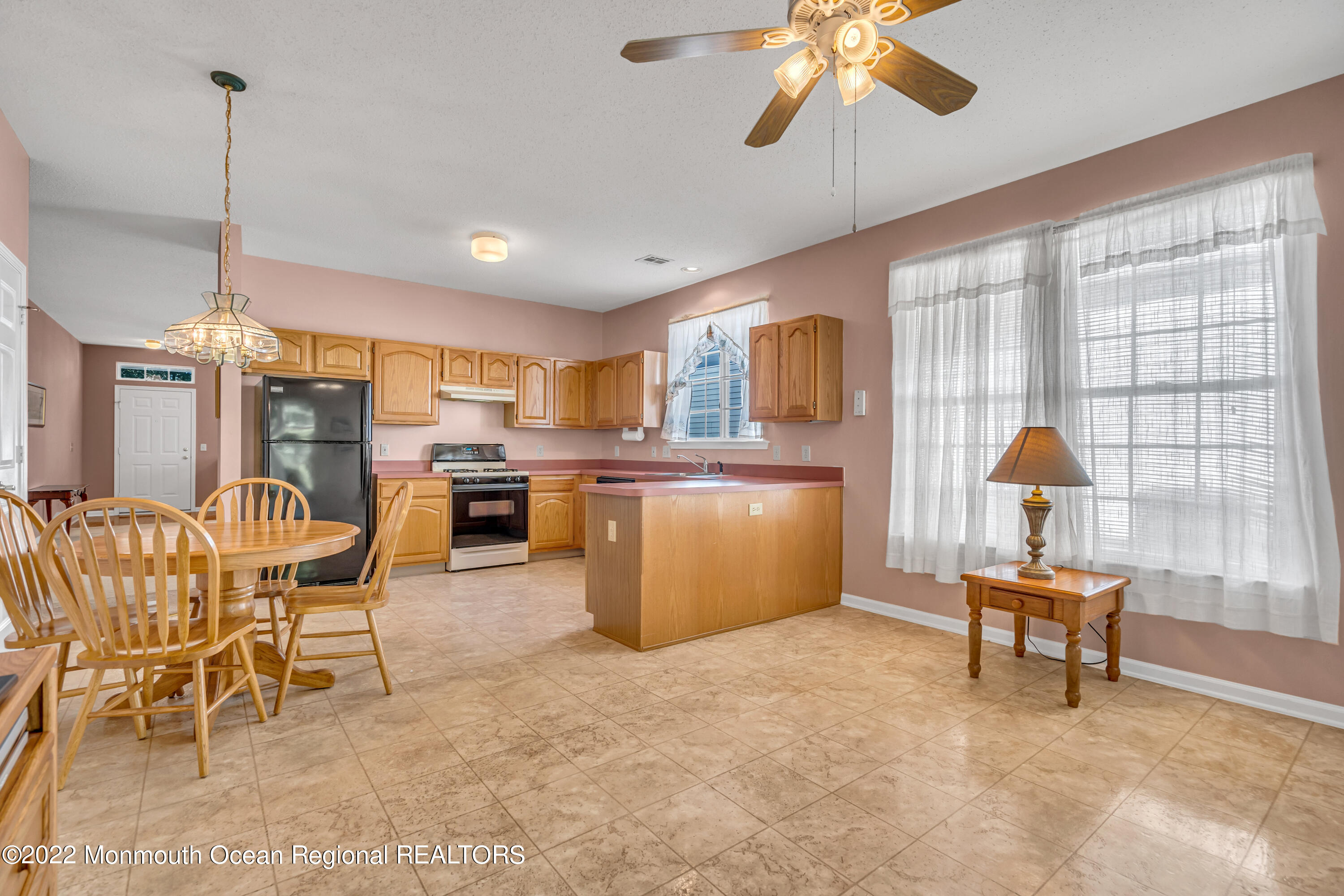 59 Quail Road Barnegat, NJ 08005 - Photo 14 of 30 a dining room with furniture and chandelier