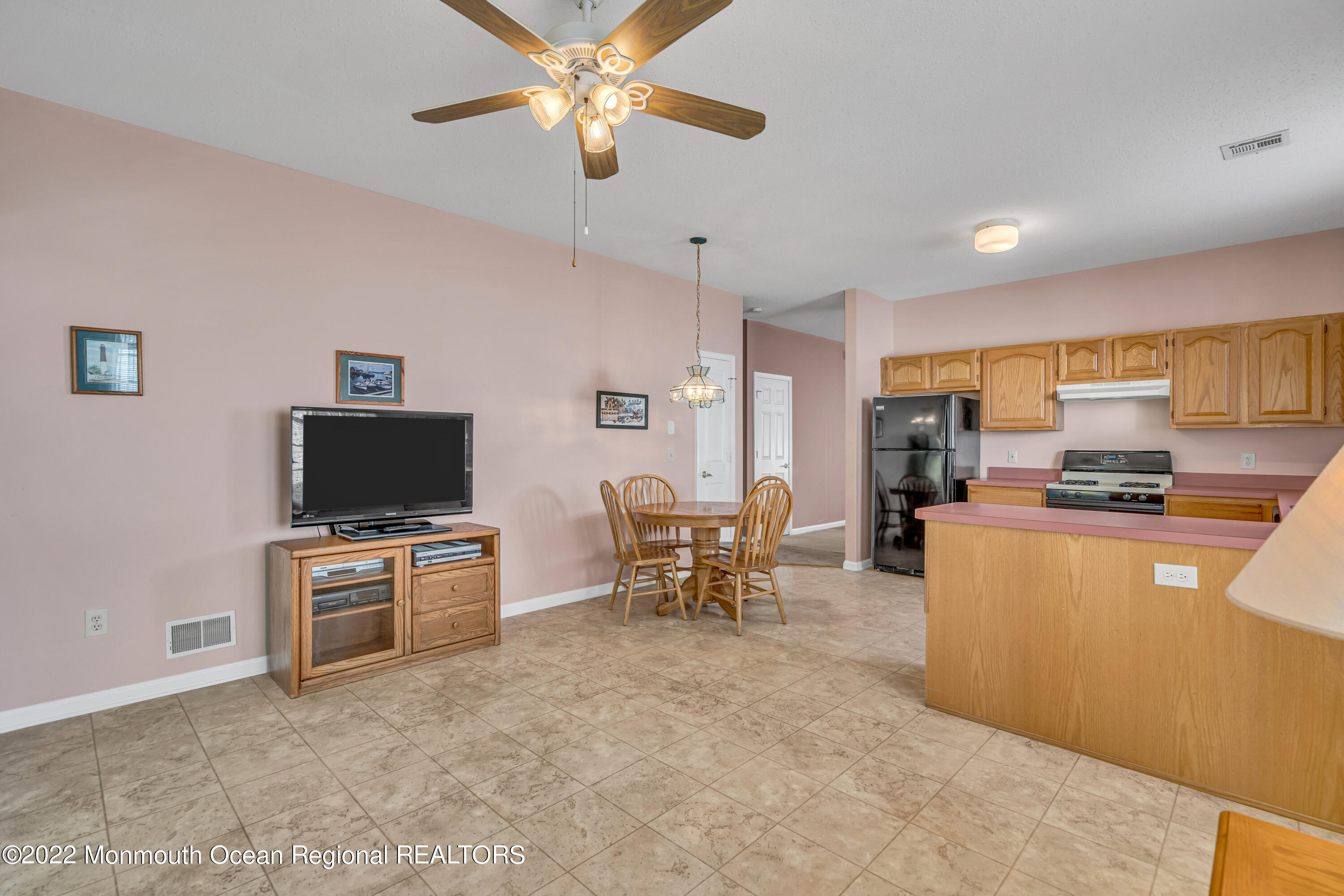 59 Quail Road Barnegat, NJ 08005 - Photo 16 of 30 a living room with furniture and a flat screen tv
