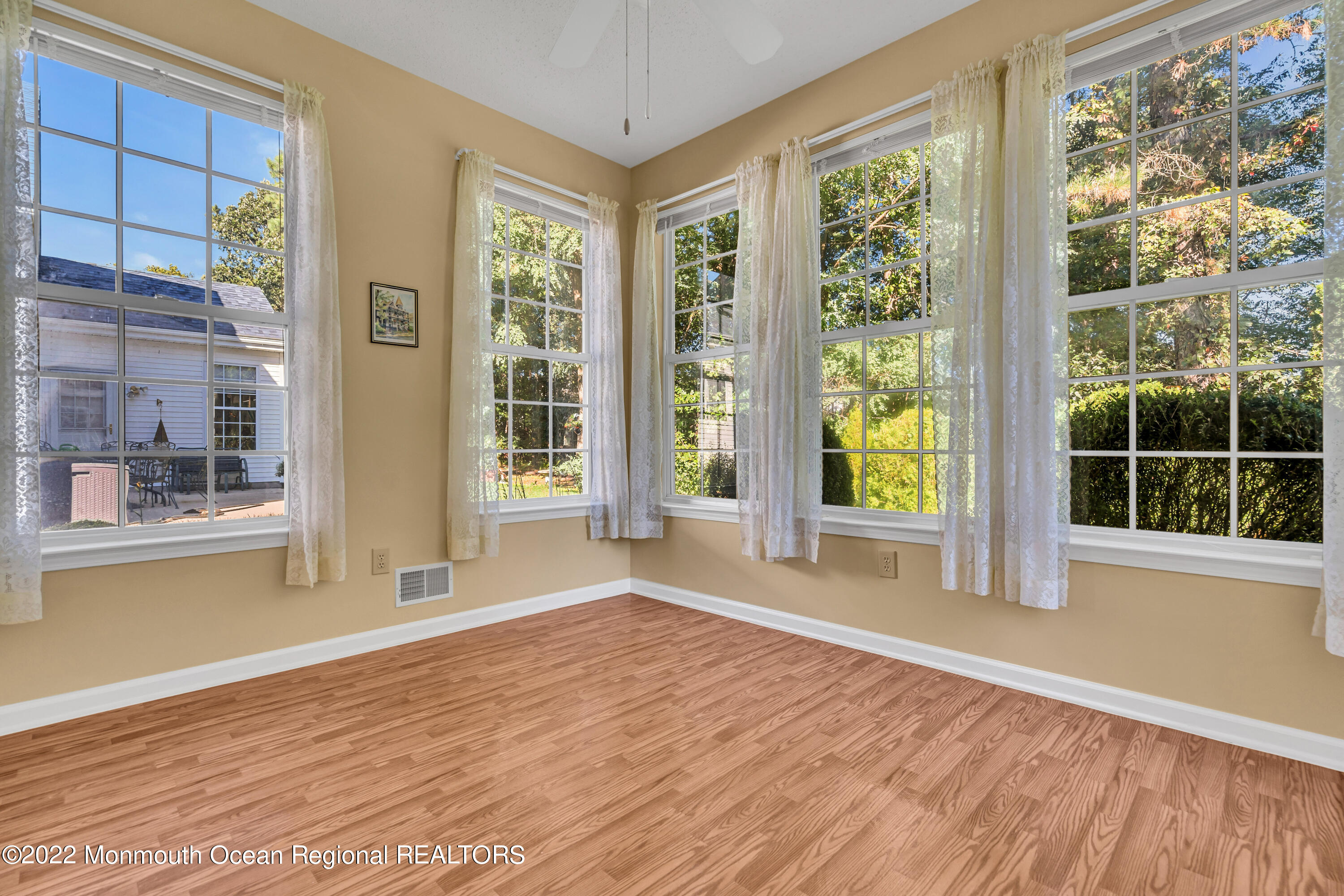 59 Quail Road Barnegat, NJ 08005 - Photo 17 of 30 a view of an empty room with a window and wooden floor