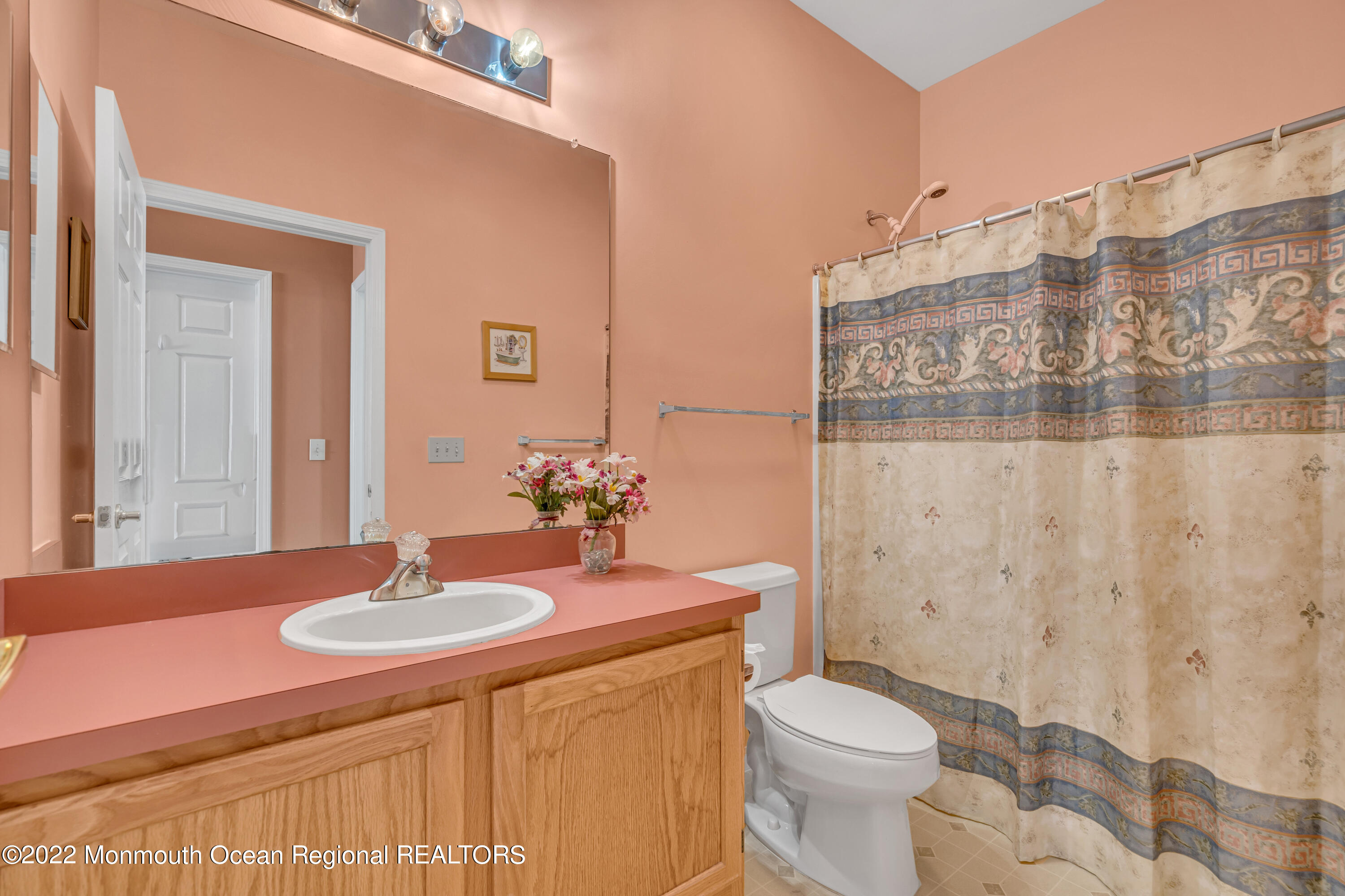 59 Quail Road Barnegat, NJ 08005 - Photo 25 of 30 a bathroom with a sink toilet and shower