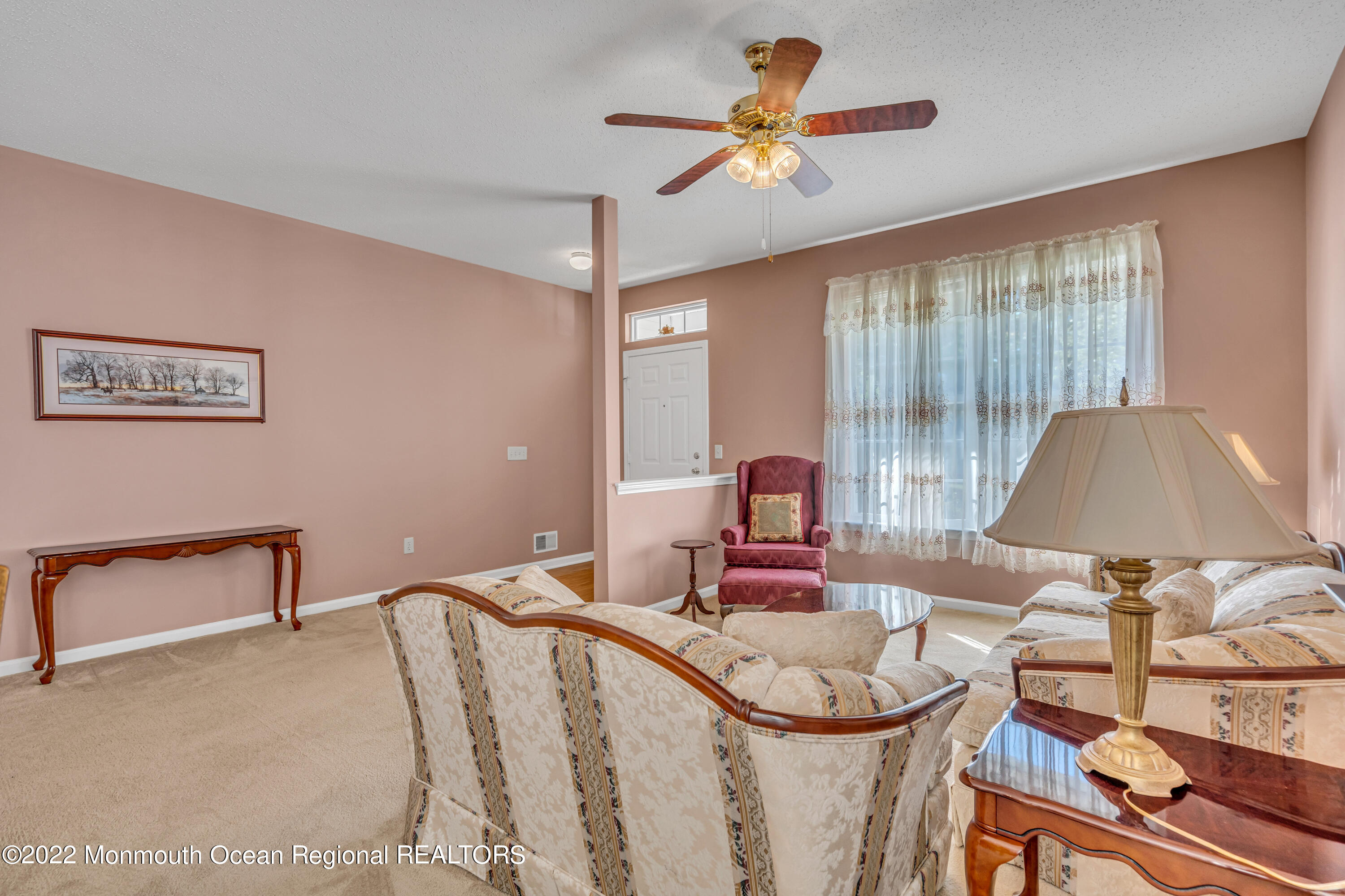59 Quail Road Barnegat, NJ 08005 - Photo 7 of 30 a bedroom with a bed and a chandelier