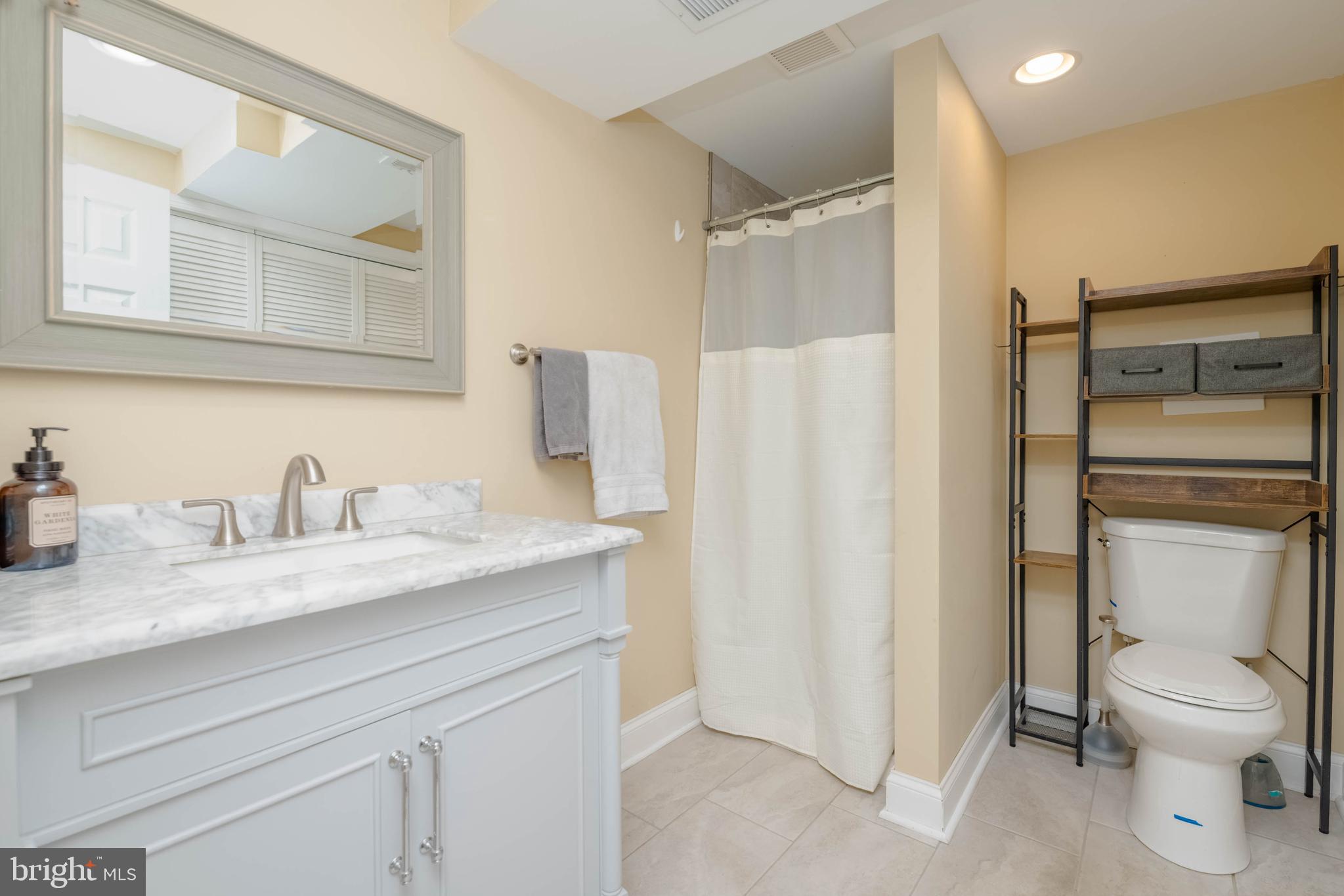 438 Chestnut Street Aberdeen, MD 21001 - Photo 14 of 28 a bathroom with a granite countertop sink toilet and shower