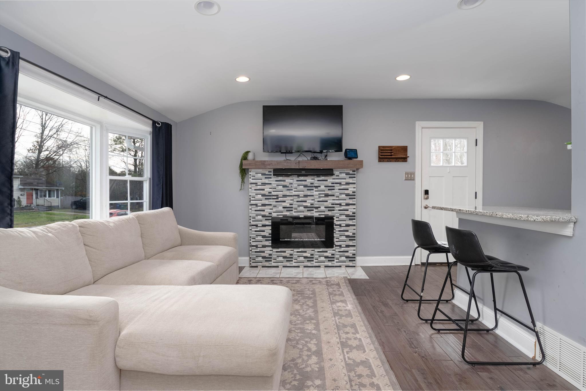 438 Chestnut Street Aberdeen, MD 21001 - Photo 3 of 28 a living room with furniture a large window and a fireplace