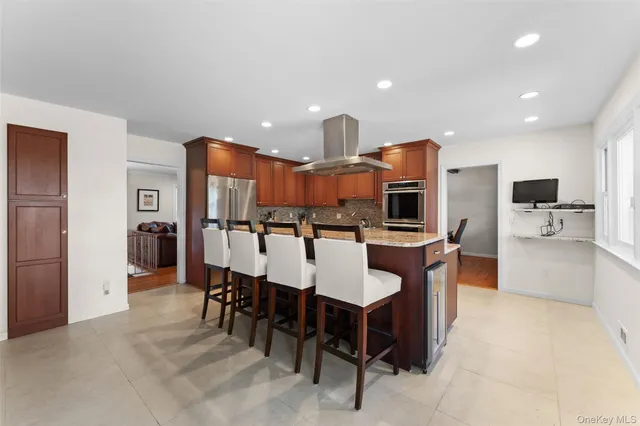 a large kitchen with a table and chairs